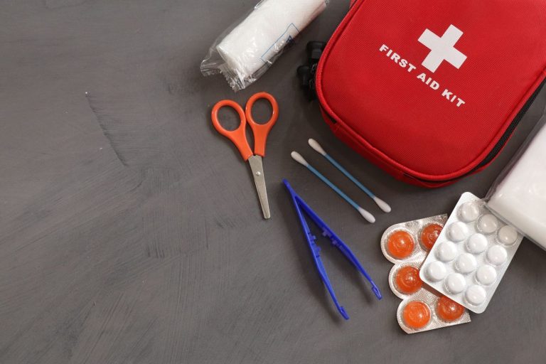 Open first aid kit with essential medical supplies